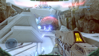 First-person view of John-117 charging up an ARC-920.
