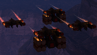 Four siege-haulers, two carrying crates, on Suban.