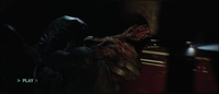 Bisenti struggling against a pod infector in Halo: Campaign Evolved.