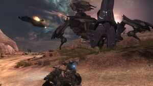 Members of NOBLE Team (Emile-A239 and SPARTAN-B312) riding an M274R Mongoose while Carter-A259's D77-TC Pelican distracts a Deutoros-pattern Scarab near Asźod ship breaking yards during Battle of Asźod. From Halo: Reach campaign level The Pillar of Autumn.