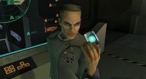 Captain Keyes hands a data crystal chip containing Cortana to John-117.