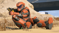 A Seeker-clad Spartan sliding on the ground.
